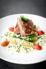 Wall Mural - fresh seared tuna steak with creamy mustard and pepper sauce