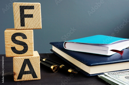 Fotografía Flexible spending account FSA written on a wooden cubes.