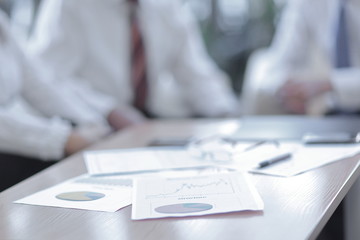 background image. closeup of a table with documents and busines