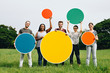 © Rawpixel.com - Happy diverse people holding round empty boards in the park