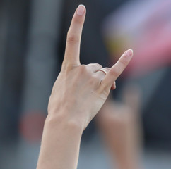 Two fingers on the hand at the concert