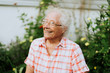 © Rawpixel.com - Happy senior woman in her garden