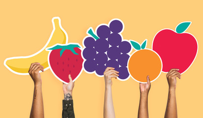 Wall Mural - Hands holding a set of fruits clipart
