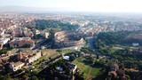 Fototapeta Do pokoju - Aerial drone view of iconic ancient Arena of Colosseum, also known as the Flavian amphitheatre in the heart of Rome, Italy