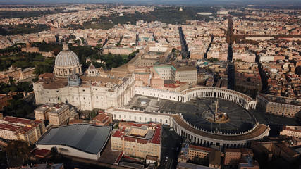 Wall Mural - Aerial drone view of Saint Peter's square in front of world's largest church - Papal Basilica of St. Peter's, Vatican - an elliptical esplanade created in the mid seventeenth century, Rome, Italy