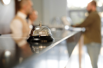 modern luxury hotel reception counter desk with bell. service bell locating at reception. silver cal