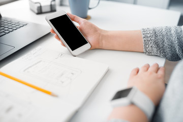Wall Mural - app design, technology and business concept - web designer or developer with smartphone and sketch i