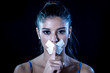 © SB Arts Media - Attractive young woman mouth sealed on adhesive tape and silence gesture