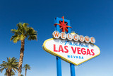 Fototapeta Las - landmarks concept - welcome to fabulous las vegas sign and palm trees over blue sky in united states of america