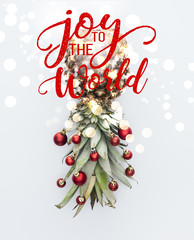 Wall Mural - top view of red christmas balls on fresh pineapple isolated on white with 