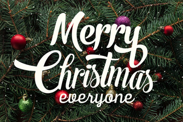 Wall Mural - full frame of colorful christmas toys on green pine tree branches with 