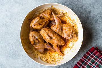 Raw Quail Meat with Sauce Ready to Cook in Bowl.