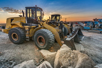 Wall Mural - Two excavators removing stone in the construction works of a road in Spain