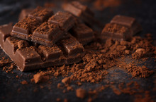 Chocolate And Cocoa Powder On A Dark Slate Plate, Macro Shot