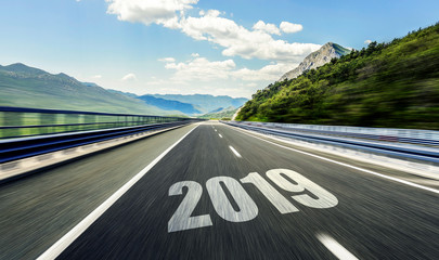 Empty asphalt road and New year 2019. Two thousand nineteen.