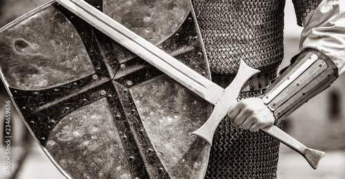 Closeup view on traditional medieval knight with shield and sword Tableau sur Toile