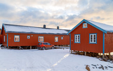 Lofoten Islands, Norway, Traditional Red Rorbu Huts In Fishing Village In Winter. Travel Norway.