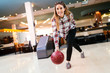 © NDABCREATIVITY - Cheerful friends bowling together and having fun