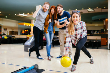 Wall Mural - Friends having fun while bowling