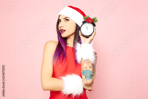 Girl With Purple Hair Tips And Tattoo On Her Arm Dressed In Red