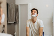 © cherryandbees - teenager preparing to shave in bathroom