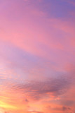Fototapeta Zachód słońca - Vertical picture of sky in the pink and blue colors. effect of light pastel colored of sunset clouds.