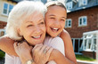 © Monkey Business - Granddaughter Hugging Grandmother On Bench During Visit To Retirement Home