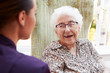 © Monkey Business - Female Resident Sitting In Chair And Talking With Carer In Retirement Home