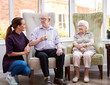 © Monkey Business - Male And Female Residents Sitting In Chair And Talking With Carer In Retirement Home