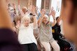 © Monkey Business - Carer Leading Group Of Seniors In Fitness Class In Retirement Home