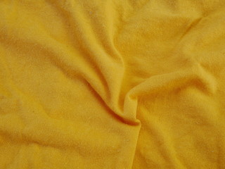 yellow silk fabric,cotton cloth background,texture of yellow clothing