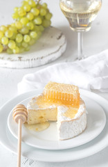 Canvas Print - Camembert with honey, grapes and white wine