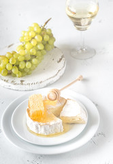 Canvas Print - Camembert with honey, grapes and white wine