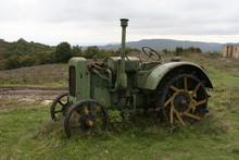 A Shot Of An Old Tracktor On A Field