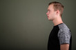© Ranta Images - Young handsome man with blond hair against colored background