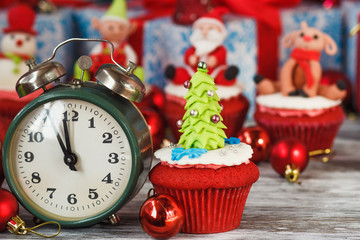 Wall Mural - Christmas cupcakes with colored decorations, blurred background