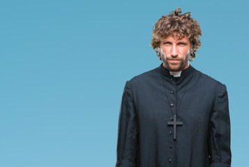 Poster - Handsome hispanic catholic priest man over isolated background skeptic and nervous, frowning upset because of problem. Negative person.