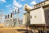 Fototapeta  - Power utility box on a power transformer in substation switchyard.