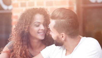 Poster - Happy loving  couple using a smartphone sitting in terrace