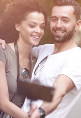 Wall Mural - Happy traveling couple making selfie, romantic mood.