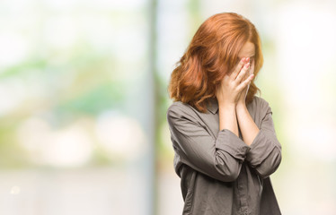 Canvas Print - Young beautiful woman over isolated background with sad expression covering face with hands while crying. Depression concept.