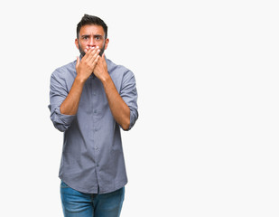 Canvas Print - Adult hispanic man over isolated background shocked covering mouth with hands for mistake. Secret concept.