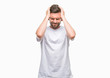 © Krakenimages.com - Young handsome man over isolated background suffering from headache desperate and stressed because pain and migraine. Hands on head.