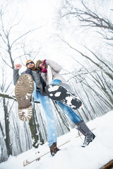 Canvas Print - Young couple having fun in snow