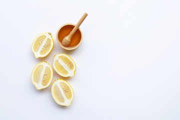 Honey with lemon on white background. Copy space