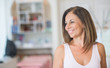 © Krakenimages.com - Beautiful middle age hispanic woman standing with smile on face at clothes store. Shop owner and shop assistant smiling confident and cheerful