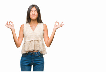 Sticker - Young asian woman over isolated background relax and smiling with eyes closed doing meditation gesture with fingers. Yoga concept.