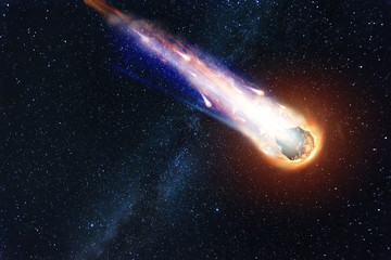 a comet, an asteroid, a meteorite falls to the ground against a starry sky. attack of the meteorite.