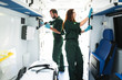 © Rawpixel.com - Paramedic team checking equipment in an ambulance