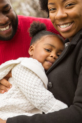 Wall Mural - Happy African American family with their baby.